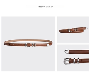 Detail of thin brown leather belt featuring a silver buckle and three-piece metal set
