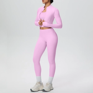 Three-piece pale pink yoga set featuring a zip-up jacket, sports bra, and high-waist leggings