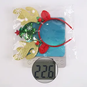 Detailed view of lightweight Christmas reindeer headband with glitter antlers and sequins
