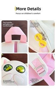 Detail of pink nursery backpack showing handles, zippers, cat decor and straps