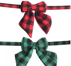 Close-up of red and green buffalo plaid pet bow tie collars with clean stitching detail