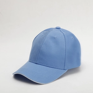 Detailed view of sky blue baseball cap with twill texture and white piping on the brim