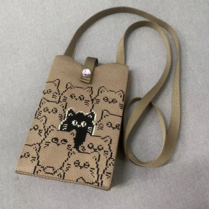 Khaki knitted crossbody phone bag with pixelated cat pattern and nylon shoulder strap