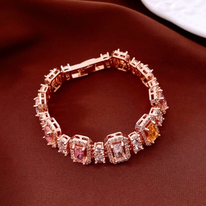 Close-up of rose gold bracelet with colorful square zircons and secure clasp