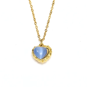 French vintage gold-plated heart necklace featuring a blue gemstone with a retro border