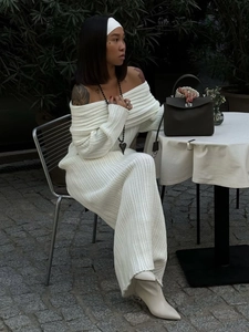 Detail of white rib-knit fabric texture on this off-shoulder long sleeve midi dress