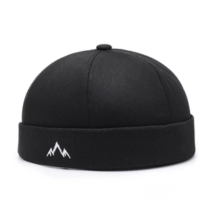 Retro black docker hat with white mountain embroidery in minimalist twill cotton