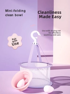 Detail of pink silicone folding cleaning bowl and purple mesh drying net for makeup sponges
