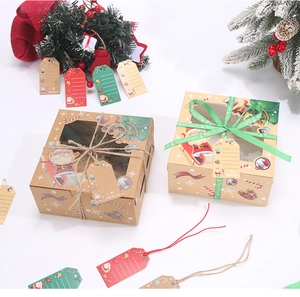 Detailed view of Christmas cupcake boxes with clear windows and festive holiday patterns