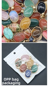 Macro detail of oval natural agate pendants with gold plating and clear poly bag packaging