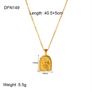 Detail of 18k gold pendant featuring palm tree and wave relief with size specifications