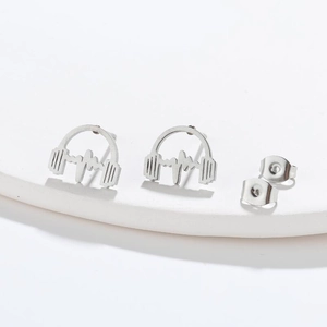 Macro shot of silver stainless steel headphone earrings with heartbeat line details
