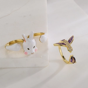 Creative 18K gold plated animal rings featuring white enamel rabbit and purple zircon hummingbird