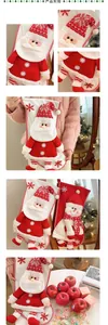 Detail of 3D knitted Santa and Snowman Christmas stockings with festive embroidery