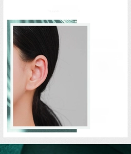 Close-up of s925 silver hollow heart ear cuff worn on the helix without piercing