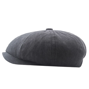 Close-up of charcoal grey cotton newsboy cap showing detailed high-density twill fabric texture