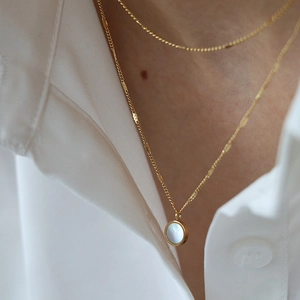 French luxury style double-layer gold necklace with round mother of pearl pendant
