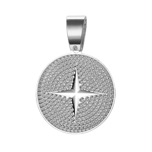 Macro shot of silver alloy round pendant with iced-out star design and textured surface