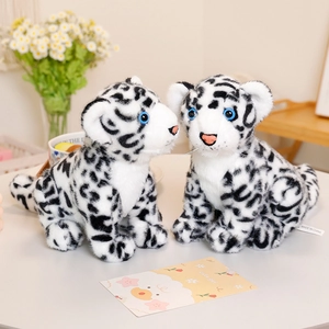 Realistic white snow leopard plush toys with blue eyes on a soft cozy background