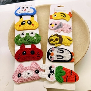 Close-up of 10-piece handmade crochet animal hair clips for girls on display cards