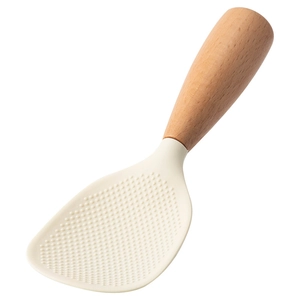 Standing non-stick silicone rice paddle with heat-resistant wooden handle on white background