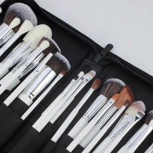 Professional 30-piece makeup brush set with white handles and black travel storage bag