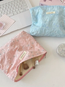 Floral jacquard makeup bags in pink and blue featuring 3D rose patterns and large capacity