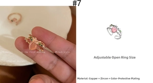 Detailed view of adjustable double-layer ring with pink heart stone and zircon accents