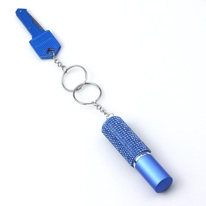 Detailed view of blue rhinestone perfume bottle keychain with metal key tool accessory