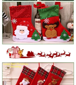 Detail of red and green large Christmas stockings with Santa, reindeer and sequin patterns