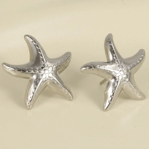 Close-up of minimalist silver starfish stud earrings made of 304 stainless steel