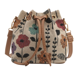 Ethnic style bucket bag with floral embroidery and brown PU leather drawstring closure