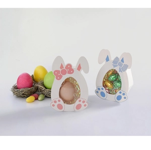 Detailed view of blue and pink Easter bunny treat boxes with clear display windows