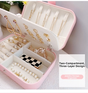Pink PU leather jewelry box detail with layered storage compartments and ring slots