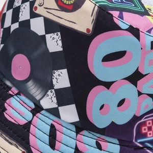 Detail of 80s retro pattern on reversible bucket hat with tapes and records print