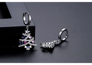 Detail of Christmas tree earrings with colorful cubic zirconia and silver-tone finish