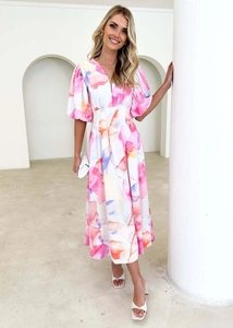 Detailed shot of watercolor floral pattern on a puff sleeve A-line maxi dress