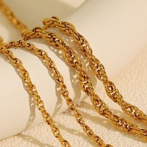 Chunky gold chain jewelry set featuring intertwined texture and 18K gold finish
