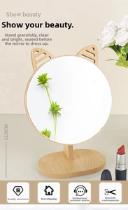 Close-up of wooden makeup mirror with cute cat ears and adjustable rotation stand