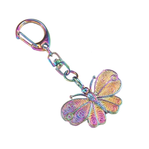 Rainbow metal butterfly keychain with hollow design and colorful D-ring clip for bags