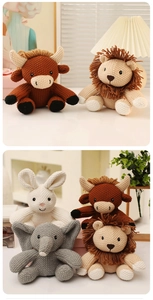 Detailed view of handmade crochet stuffed animals including a lion, cow, bunny, and elephant