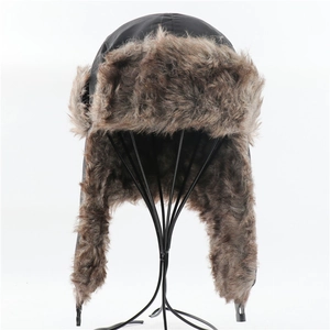 Detail of waterproof trapper hat featuring black nylon shell and thick faux fur lining