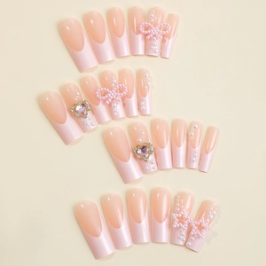French long square press-on nails with pink 3D bows, pearls and heart rhinestones