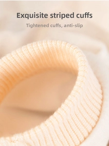 Detailed macro view of the elastic ribbed knit cuffs on this pet banana jumpsuit