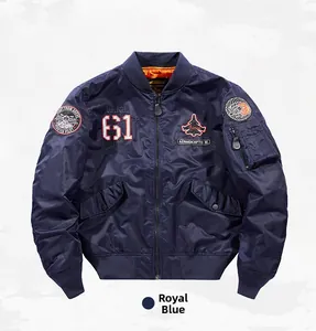 Detail of royal blue MA-1 flight jacket with flight-themed embroidery and orange lining