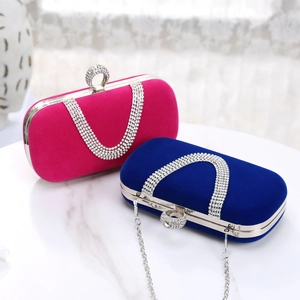 Exquisite pink and blue suede evening bags with diamond encrusted rings and metal chains
