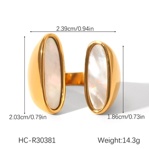 Detailed view of gold stainless steel open ring featuring dual oval white shells inlay