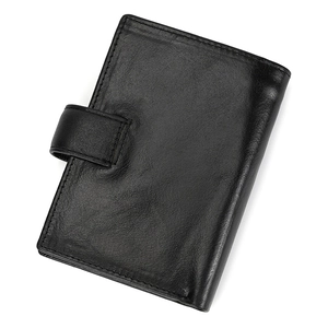 Detail of premium black genuine leather wallet with fine grain texture and snap fastener