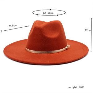 Detail of orange wool fedora featuring golden belt buckle and 9.5cm wide brim dimension