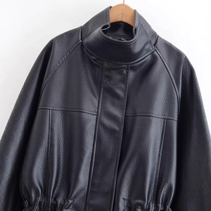 Women's black faux leather jacket with stand collar and adjustable waist drawstring